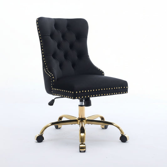 Black office chair with gold accents on a white background