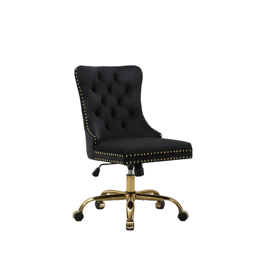 Black office chair with gold accents in a home office setting